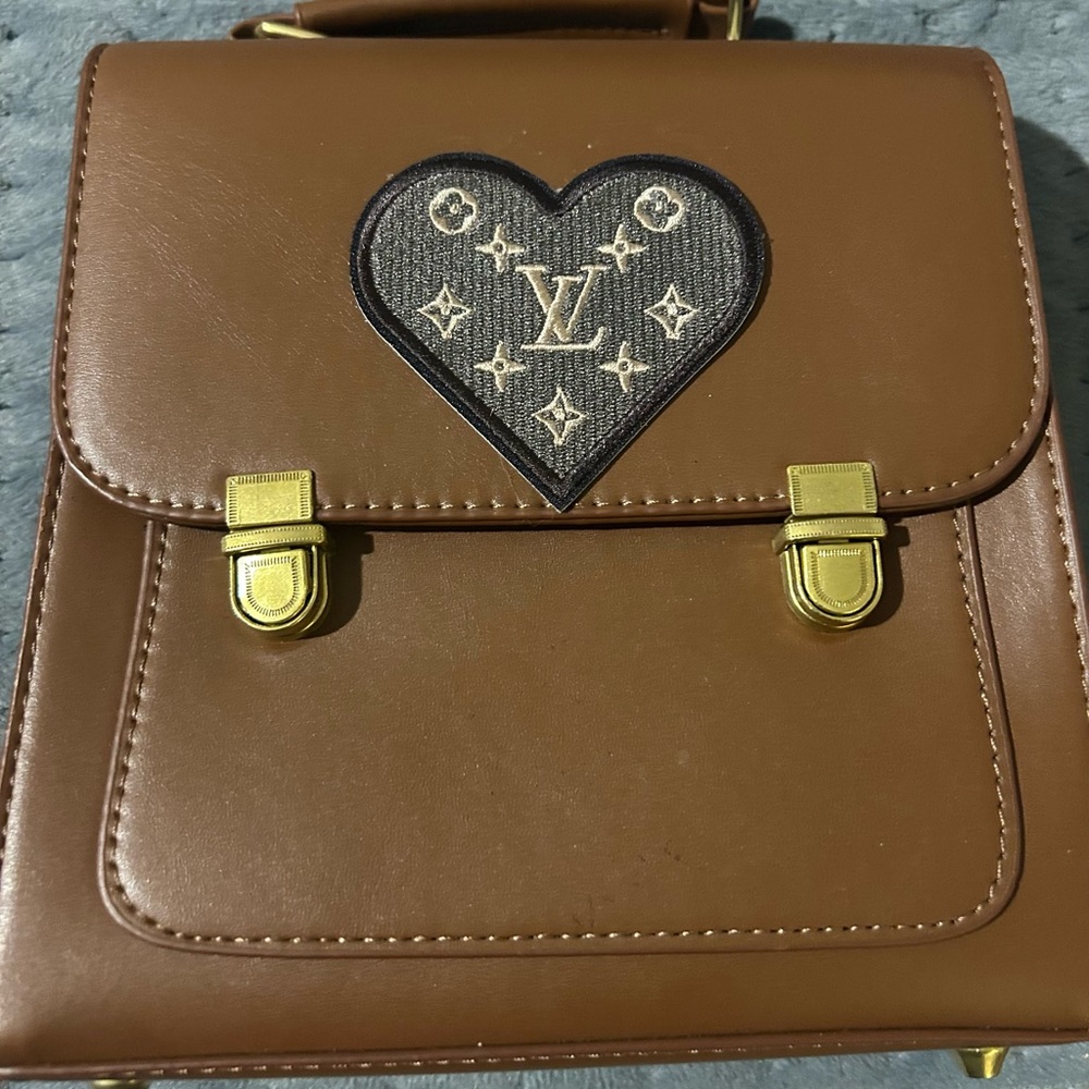 Tan Leather Backpack with Gold Accents